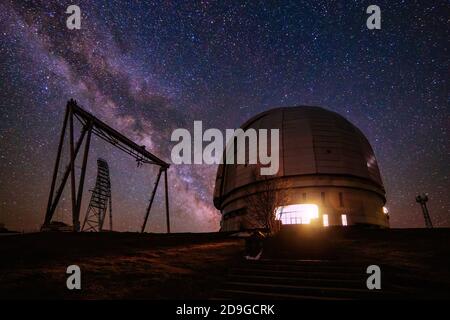 Special astrophysical observatory against starry night sky with milky way Stock Photo