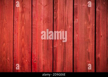 Red wooden grunge board closeup. Natural texture. Can be used like nature background Stock Photo