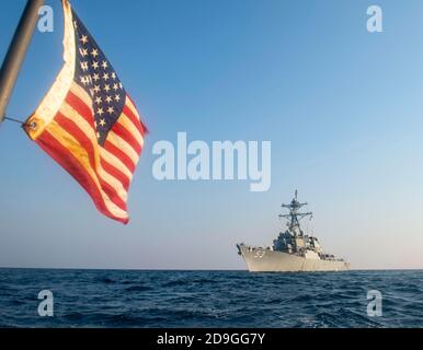 The U.S. Navy Arleigh Burke class guided-missile destroyer USS John Paul Jones patrols as part of the Coalition Task Force Sentinel October 27, 2020 in the Arabian Gulf. Stock Photo