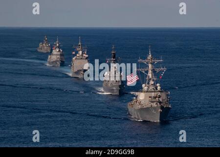 U.S. Navy ships assigned to the Ronald Reagan Carrier Strike Group and ships of the Japan Maritime Self-Defense Force sail in formation during exercise Keen Sword 21 October 26, 2020 in the Philippine Sea. Stock Photo