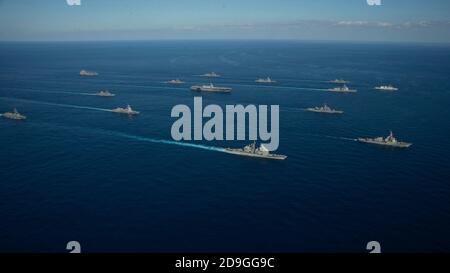 U.S. Navy ships assigned to the Ronald Reagan Carrier Strike Group joined ships of Japan Maritime Self-Defense Force sail in formation during exercise Keen Sword 21 October 26, 2020 in the Philippine Sea. Stock Photo