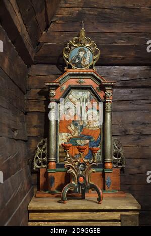 Traditional Carpathian icon of the Annunciation dated from the middle of the 18th century on the Prothesis in the altar of the of Saint Nicholas' Church in Jiráskovy Gardens in Hradec Králové in Eastern Bohemia, Czech Republic. The wooden church was built in 1502-1510 the village of Habura near Medzilaborce, Eastern Slovakia. In 1744 the church was sold and moved to the nearby village of Malá Pol'ana. The church was hardly damaged during the First World War. In 1934, the remains of the wooden church were sold again and moved to Hradec Králové. Stock Photo