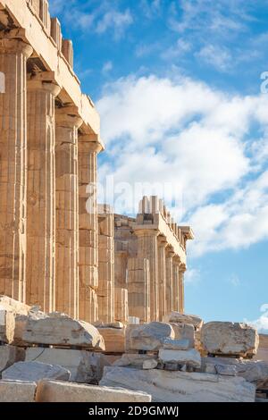 Doric columns of the Parthenon against a blue sky with clouds, Acropolis in Athens Stock Photo