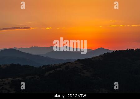 tonal shadow among mountains at sunset Stock Photo