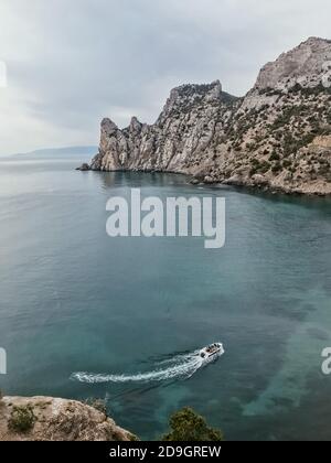 Aerial view of beautiful floating speed boat in blue sea Stock Photo ...
