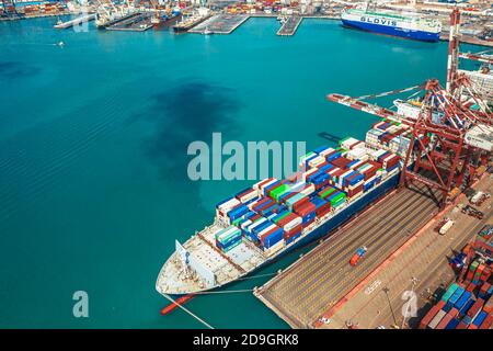 Aerial view container ship carrying container in import export business logistic and transportation of international by container ship in the open sea