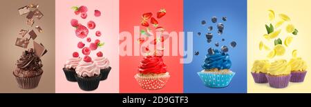 Different delicious cupcakes and flying ingredients on color background Stock Photo