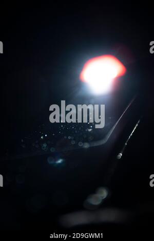 Flashlight lighten blurred dust in the dark. Stock Photo