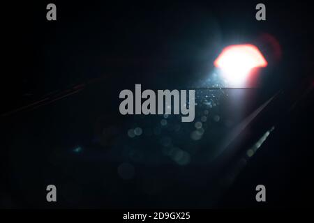 Flashlight lighten blurred dust in the dark. Stock Photo