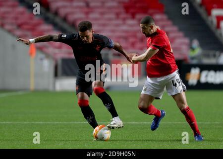 Lisbon. 5th Nov, 2020. James Tavernier (L) of Rangers FC vies with Adel Taarabt of SL Benfica during the UEFA Europa League group D football match between SL Benfica and Rangers FC in Lisbon, Portugal on Nov. 5, 2020. Credit: Pedro Fiuza/Xinhua/Alamy Live News Stock Photo
