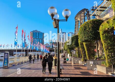 People walking along the waterfront at Darling Harbour, Sydney, Australia Stock Photo