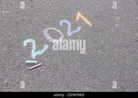 Figure 2021 written on asphalt outdoors Stock Photo
