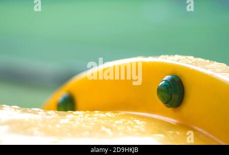 Raindrop on plastic tunnel toy at the school yard after the morning rain Stock Photo