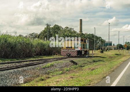 MACKAY, QUEENSLAND, AUSTRALIA - JUNE 2019: A locomotive stationery while changing lines after pulling bins of harvested sugar cane to the refinery Stock Photo