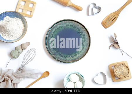 Composition with baking ingredients and kitchen accessories on a white background. Stock Photo