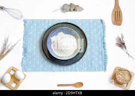 Composition with baking ingredients and kitchen accessories on a white background. Stock Photo