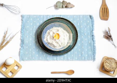 Composition with baking ingredients and kitchen accessories on a white background. Stock Photo