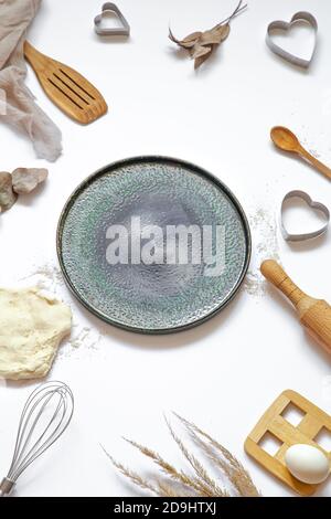 Composition with baking ingredients and kitchen accessories on a white background. Stock Photo