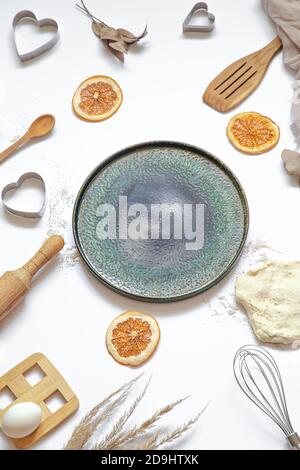 Composition with baking ingredients and kitchen accessories on a white background. Stock Photo