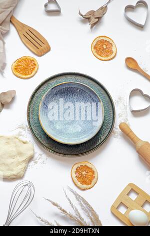 Composition with baking ingredients and kitchen accessories on a white background. Stock Photo