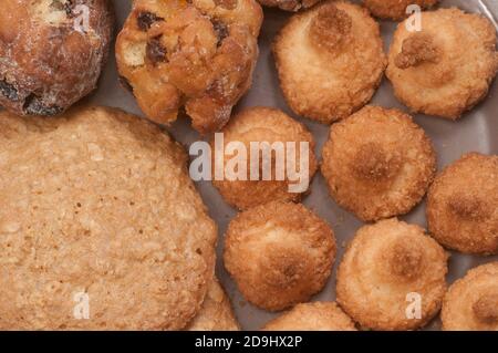 Cakes assort collection on a ceramic plate, close up Stock Photo