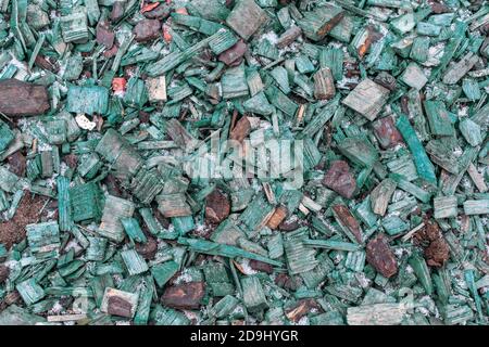 Green wood chips for decorating city streets top view, texture of natural wood flooring from painted and unpainted wood. Textured effect background fo Stock Photo