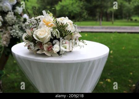 Bouquet of flowers on table in park Stock Photo