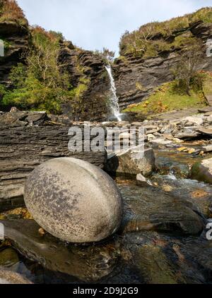 Large, smooth  round, oval, egg-shaped rock on Boreraig Beach, Isle of Skye, Scotland, UK Stock Photo