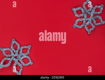 Christmas background in red with silver snowflakes. Stock Photo