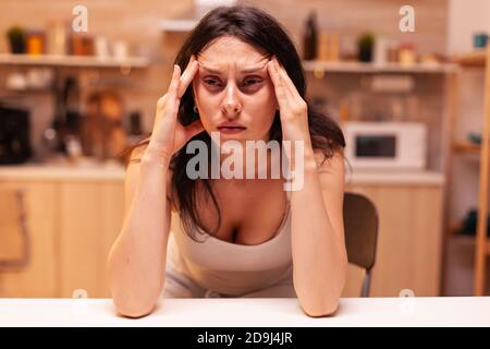 Woman with dizziness, Stressed tired unhappy worried unwell wife suffering of migraine, depression, disease and anxiety feeling exhausted with allergy symptoms Stock Photo