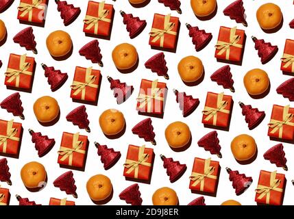 Christmas, New Year's pattern from tangerines, a gift and a Christmas tree toy. Stock Photo