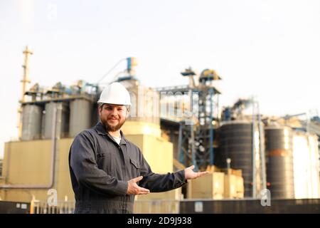 Portrait of industrial worker and engineer showing factory exterior outdoors. Stock Photo