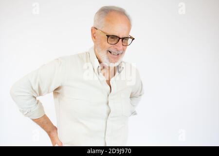 Portrait and close up image of a senior man having a hip pain against white background Stock Photo