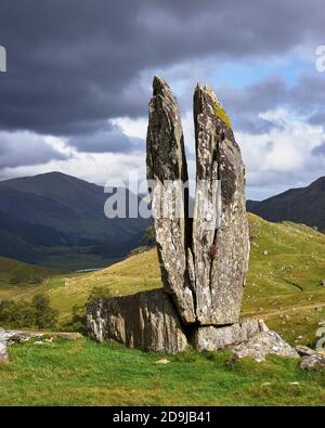 A split upright stone in Gleinn Dà-Eigg, Glen Lyon, known as the Praying Hands of Mary or Fionn’s Rock, Perth and Kinross, Scotland. Stock Photo