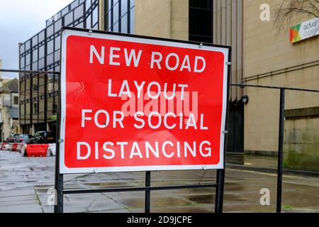 A red sign for a new social distancing road layout in Bath city centre. Stock Photo