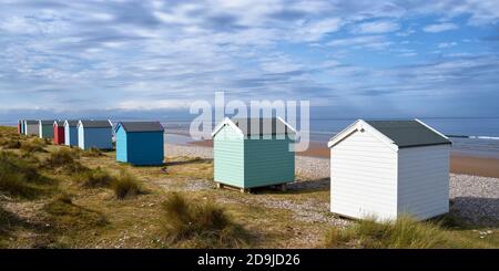 Colouful beach huts at Findhorn beach, Moray, Scotland.  Panoramic Stock Photo