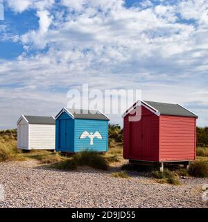Colouful beach huts at Findhorn beach, Moray, Scotland. Stock Photo