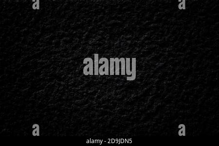 Close-up of a bumpy granite stone wall. Dark, almost black, high resolution full frame textured background. Stock Photo