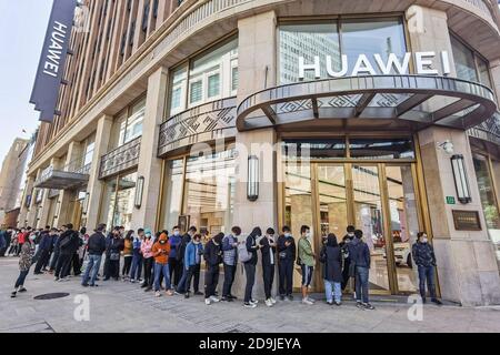 Customers queue at the flagship store of Huawei located on the east Nanjing road to book the newly released Huawei Mate 40 and experience products of Stock Photo