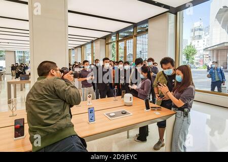 Customers queue at the flagship store of Huawei located on the east Nanjing road to book the newly released Huawei Mate 40 and experience products of Stock Photo