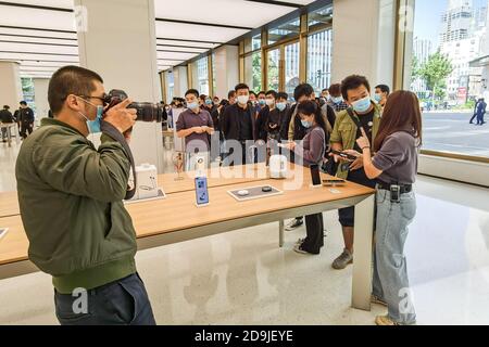 Customers queue at the flagship store of Huawei located on the east Nanjing road to book the newly released Huawei Mate 40 and experience products of Stock Photo