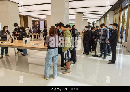 Customers queue at the flagship store of Huawei located on the east Nanjing road to book the newly released Huawei Mate 40 and experience products of Stock Photo