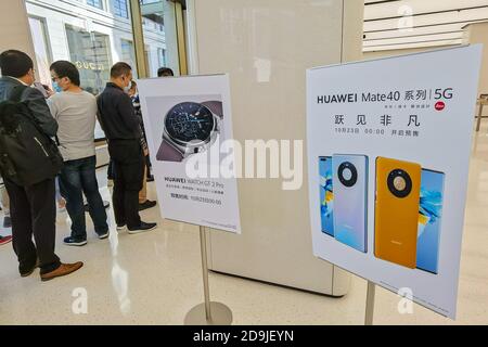 Customers queue at the flagship store of Huawei located on the east Nanjing road to book the newly released Huawei Mate 40 and experience products of Stock Photo