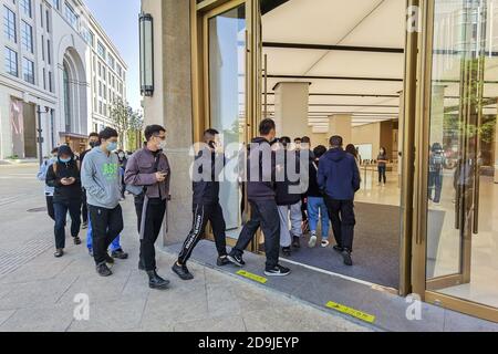 Customers queue at the flagship store of Huawei located on the east Nanjing road to book the newly released Huawei Mate 40 and experience products of Stock Photo