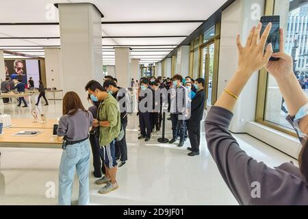 Customers queue at the flagship store of Huawei located on the east Nanjing road to book the newly released Huawei Mate 40 and experience products of Stock Photo