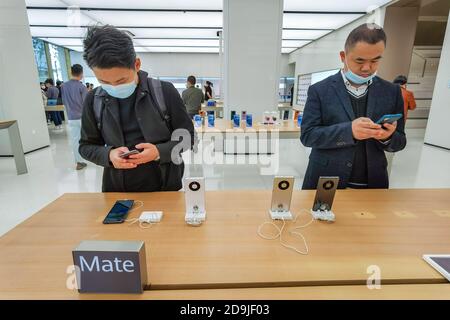 Customers queue at the flagship store of Huawei located on the east Nanjing road to book the newly released Huawei Mate 40 and experience products of Stock Photo