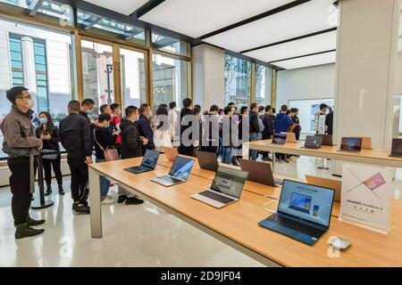 Customers queue at the flagship store of Huawei located on the east Nanjing road to book the newly released Huawei Mate 40 and experience products of Stock Photo