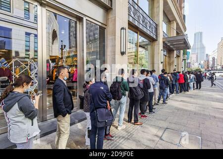 Customers queue at the flagship store of Huawei located on the east Nanjing road to book the newly released Huawei Mate 40 and experience products of Stock Photo