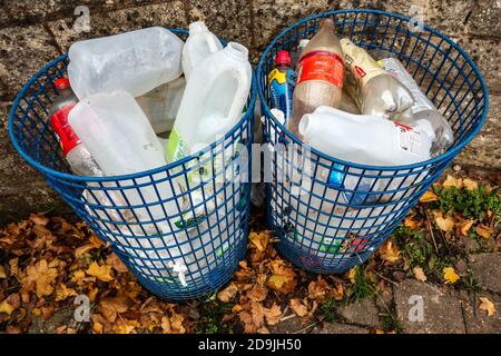 2 waste bins full of empty plastic bottles for recycling Stock Photo