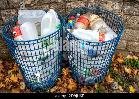 2 waste bins full of empty plastic bottles for recycling Stock Photo